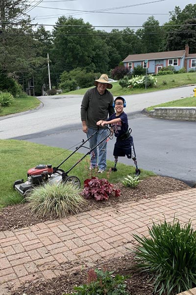 Robert mowing lawn