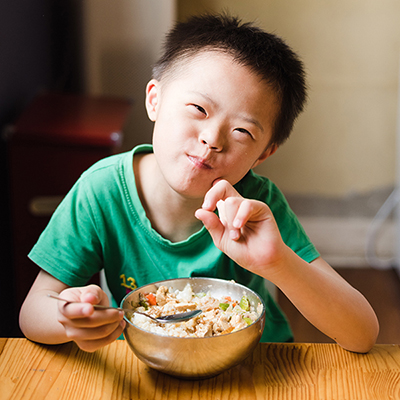 Brody enjoys a nutritious meal. Help kids like Brody on Giving Tuesday