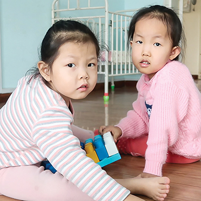 two girls at healing home play together